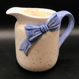 Vintage speckled ceramic creamer w blue bow